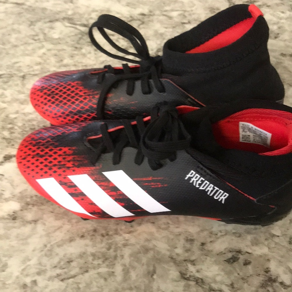 Brand new size 2 Predator soccer shoes for boys.